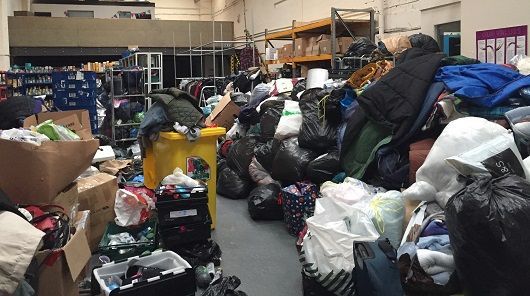 Simon Community Scotland warehouse filled with donations everywhere, needing to be sorted