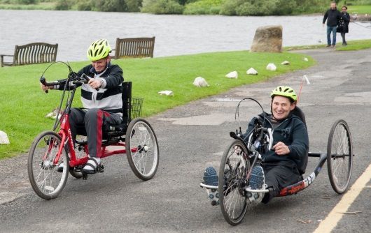 People with spinal injuries on hand bikes SIS BBQ 2017