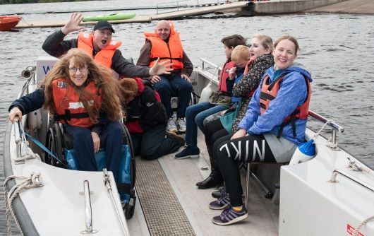 Members from Spinal Injuries Scotland and Queens Elizabeth National Spinal Injuries Unit on a boat at Activity Day Out