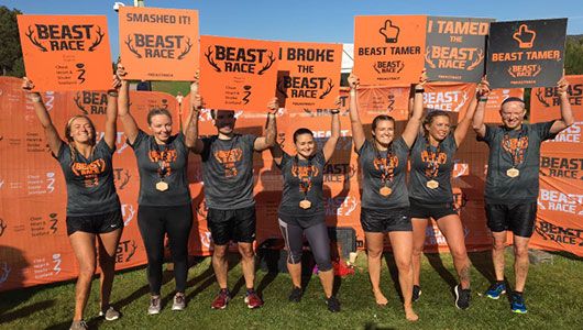 Aberdeen office beast race team 2019 celebrating finishing the course