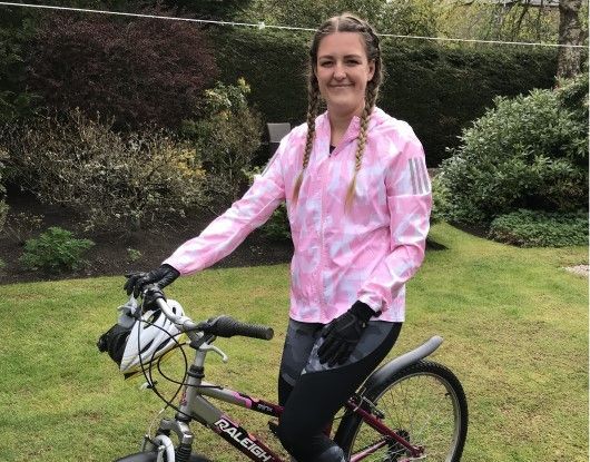 Kimberley MacLennan from Digby Brown Aberdeen Office on her bike as she competes in 2.6 Challenge for charity Sunrise Partnership