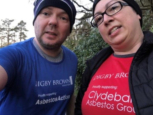 A picture of two people taking part in the one million steps for meso wearing fundraising t-shirts