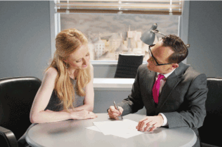 Woman getting advice from solicitor