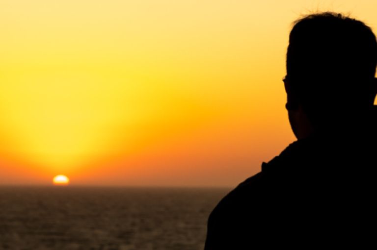 Man looking out to sea