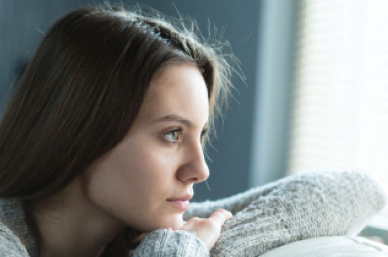 Woman looking out window