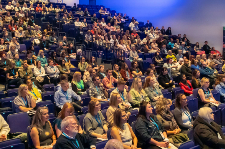 A busy room full of attendees at the first-ever National Head Injury Conference 2025.