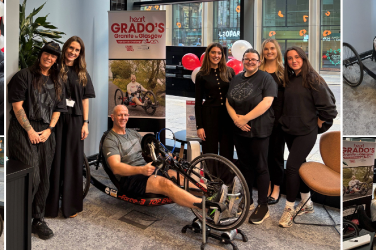 Digby Brown staff on a stationary handcycle