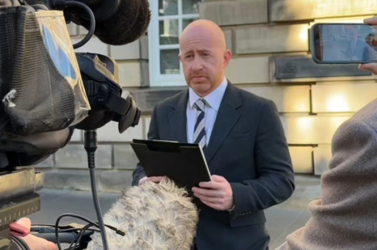 Ryan Smith, Partner in our Kirkcaldy office, pictured reading a statement to media outside the High Court in Edinburgh