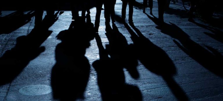 People in a dark alley