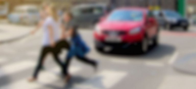 People crossing the road at a zebra crossing