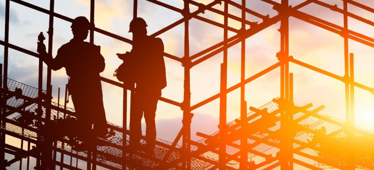 Workers up scafolding