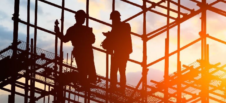 Workers up scaffolding