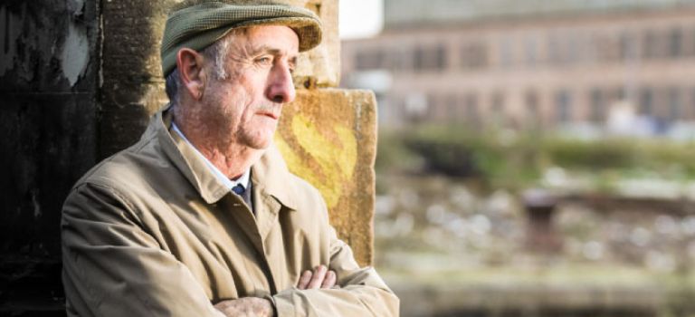 Older man looking thoughtful