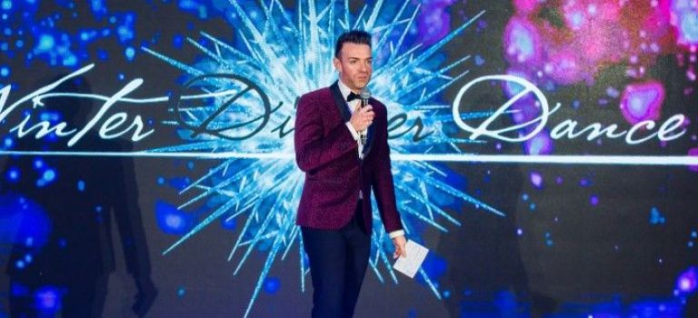 Des Clarke, compere on stage at Digby Brown Winter Dinner Dance 2019 for Spinal Injuries Scotland