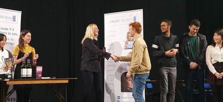 Trish giving out prizes to winners at Edinburgh Debates Union Competition 2019