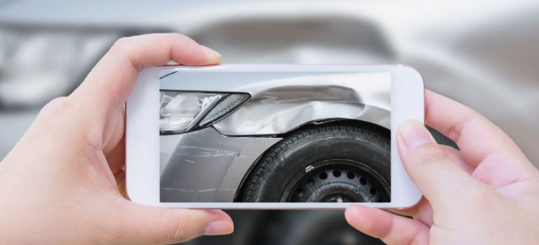 Taking photo of damaged car with smartphone