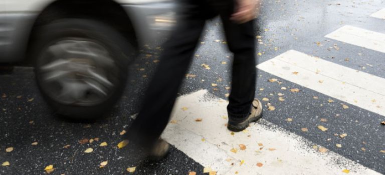 Pedestrian crossing a road at zebra crossing