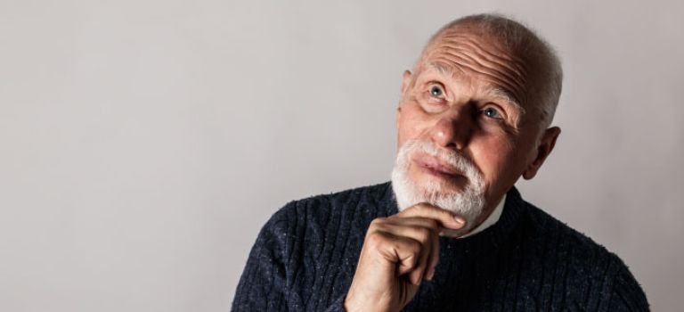 Older man looking thoughtful