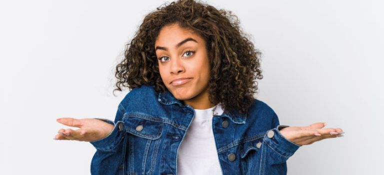 Lady shrugging asking question