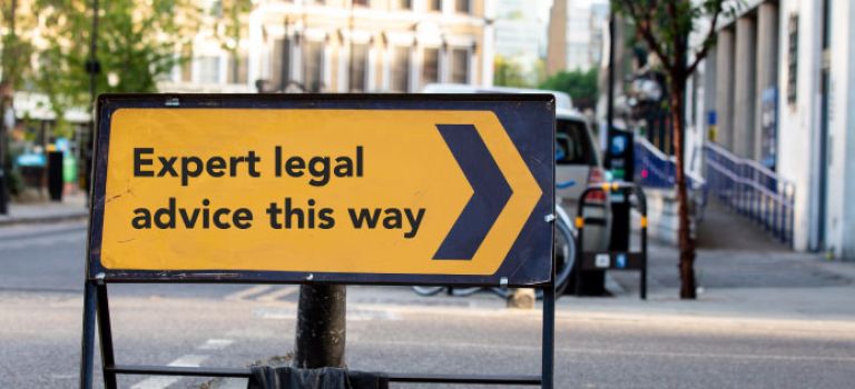 Road sign saying "Expert legal advice this way"
