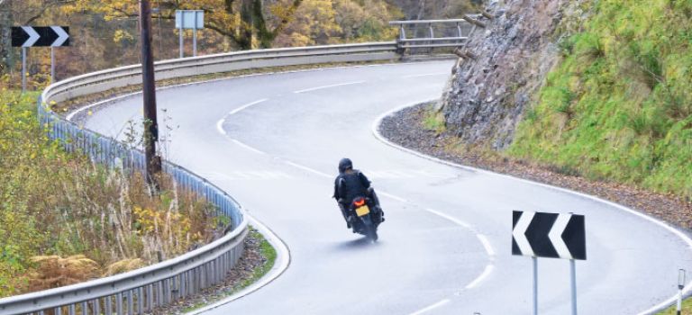 Motorcycle on scottish roads going round bends