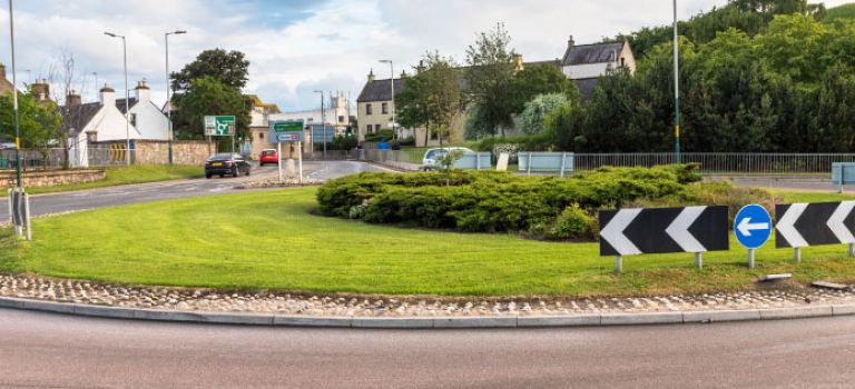 Waiting at a roundabout