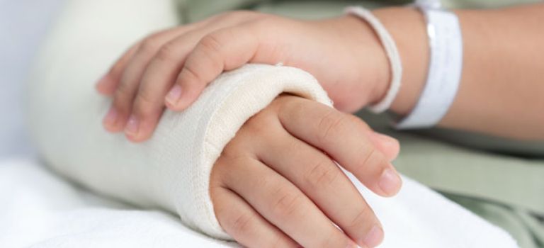 Girl with arm in cast