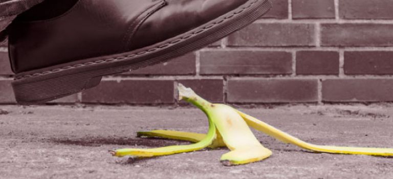 Man about to slip on banana skin