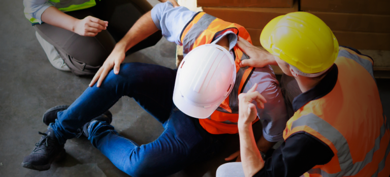 Injured worker receives help from colleagues after a career-ending workplace accident