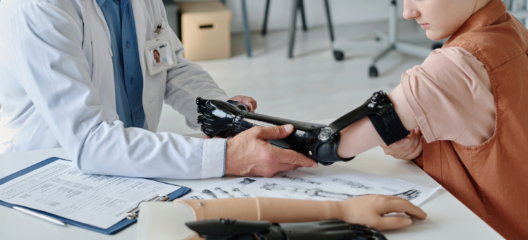 Doctor assisting amputee with proper prosthetic fitting