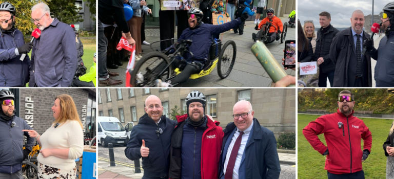 Digby Brown staff pictured with Grado across Scotland on various stops of his handcycle challenge