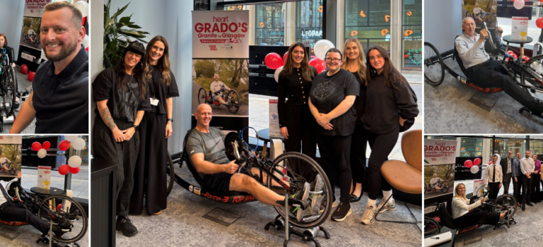 Digby Brown staff on a stationary handcycle