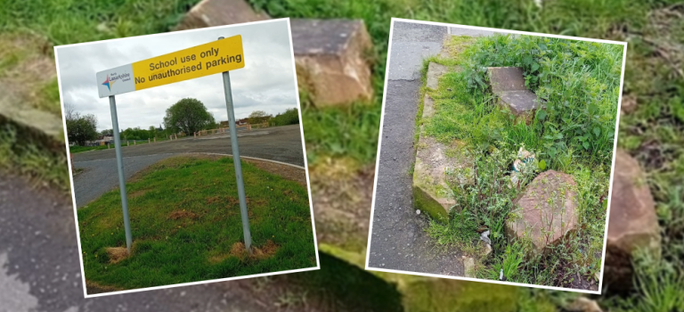 Image shows large stones/boulders left on the edge of a pavement following the demolition of a wall.