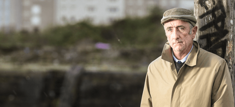 Older man looking sad