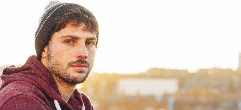 Man looking thoughtful to camera