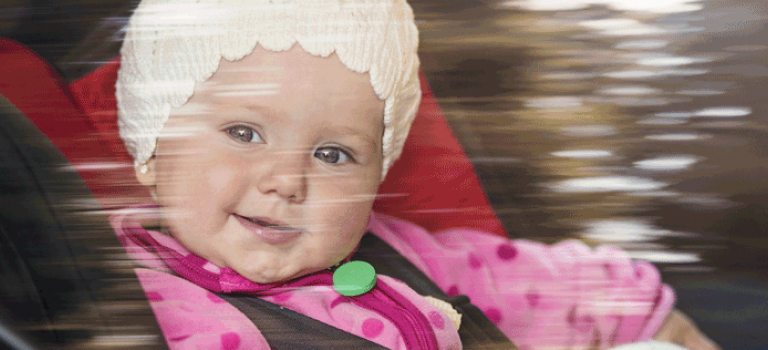 Child in car seat looking out window