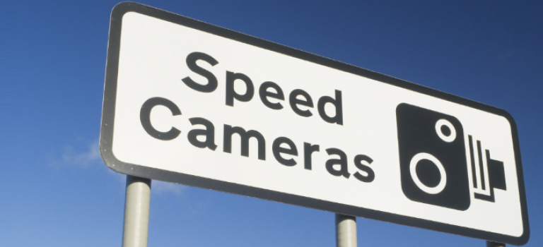 Speed camera warning sign