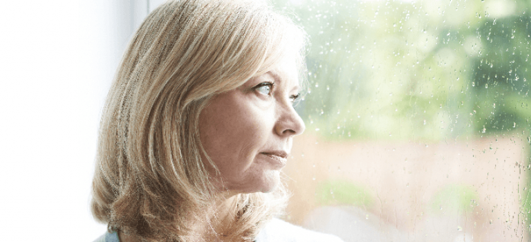 Woman looking out of window