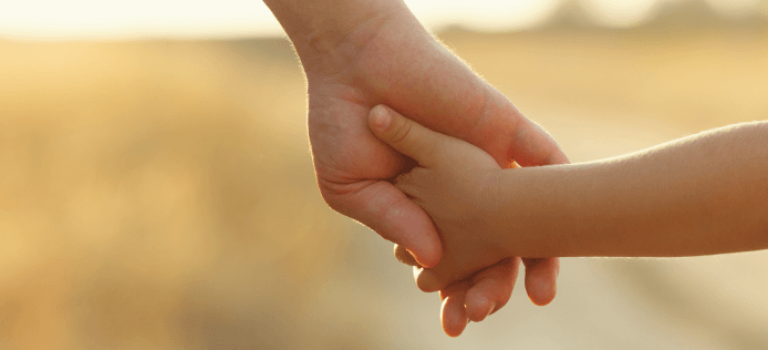 Parent holding childs hand